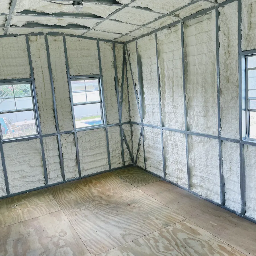 Closed-cell spray foam insulation applied to wall cavities in a residential project in Gates